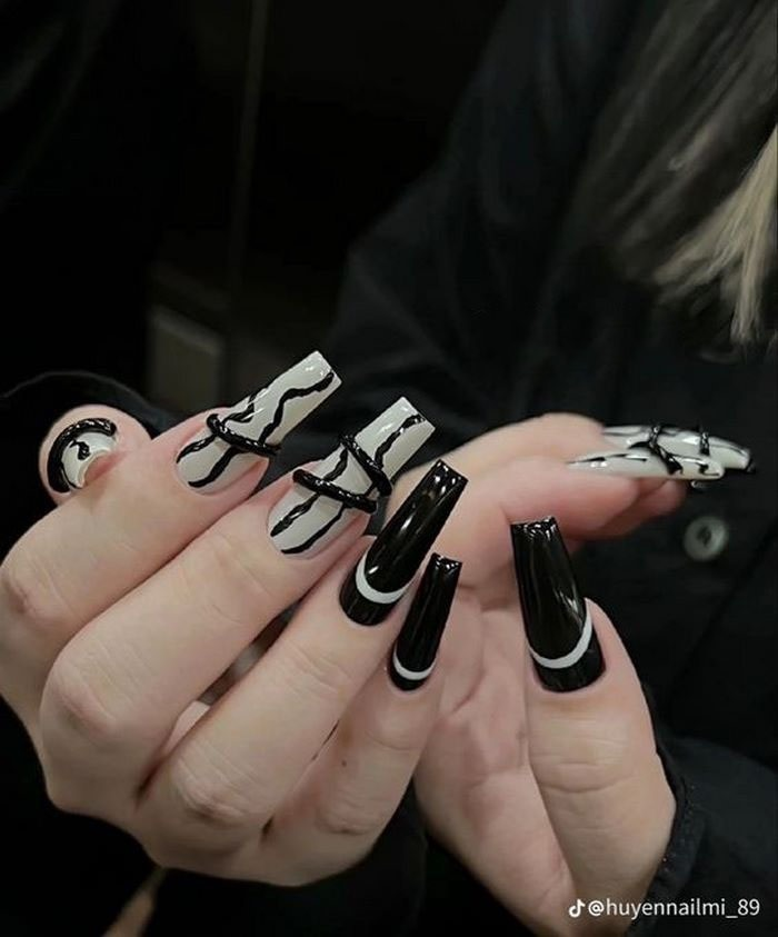 Painted nail design with unique 3D motifs