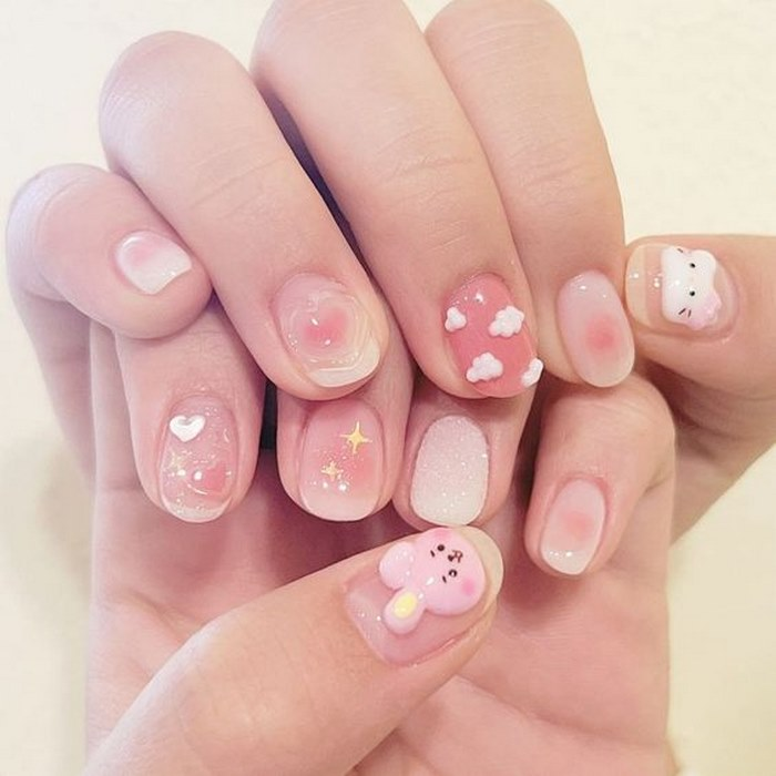 Short pink nails with lovely 3D shapes