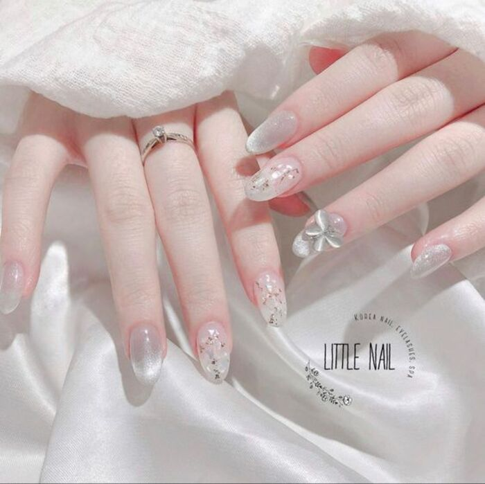 White wedding day nail with unique cat's eye stone combination
