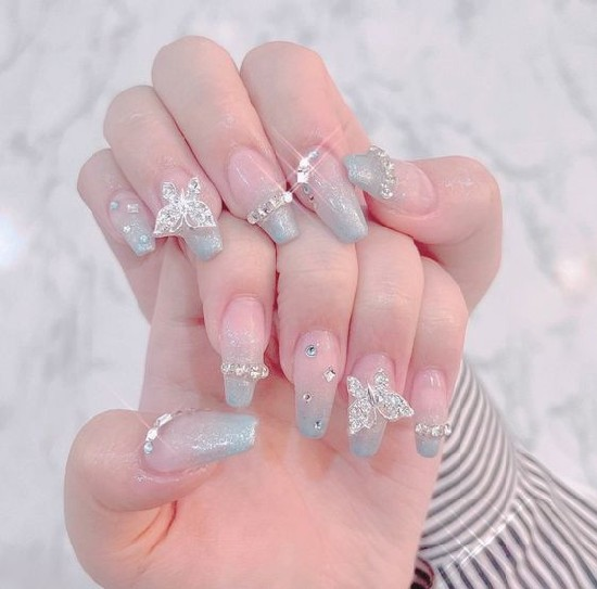 Nail design for a wedding party with charms