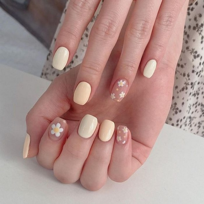 Pink and white nails painted with flowers