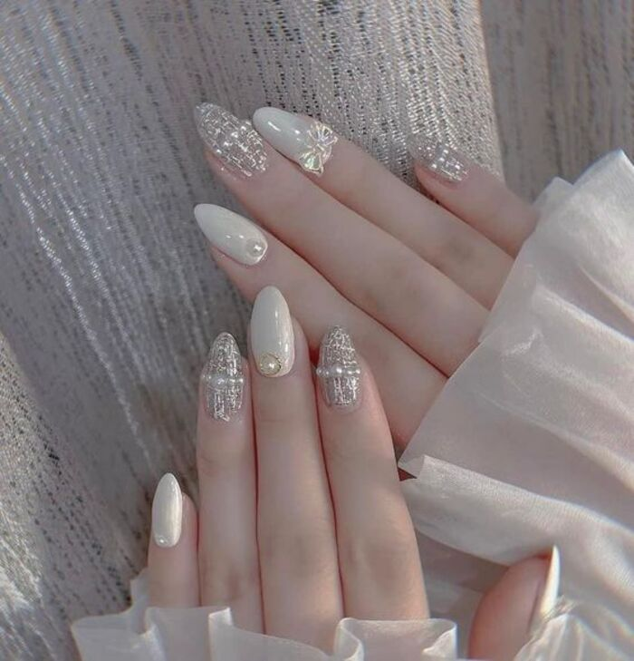 Beautiful, short, pointed, sparkling white nails