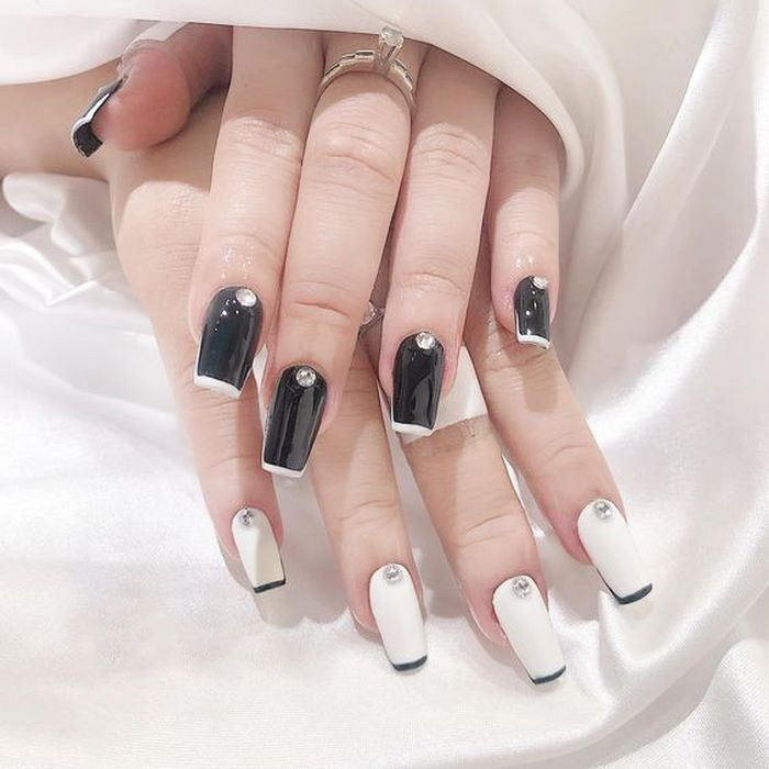 Black nails with white and white nails with black combined with stones