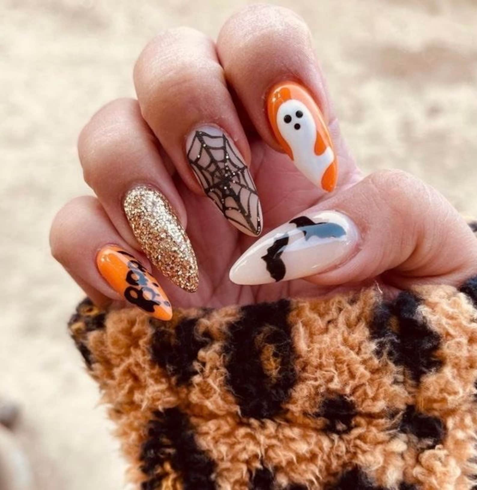 From scary to sweet, our collection of Halloween nail designs will please every taste