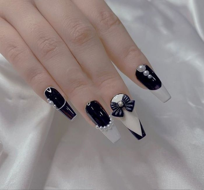 Add charm to keep neutral colored nails from being boring