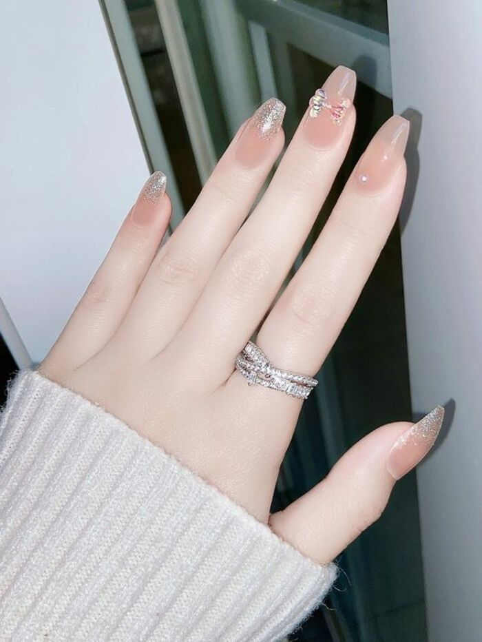 2024 bridal nails are milky orange with glitter