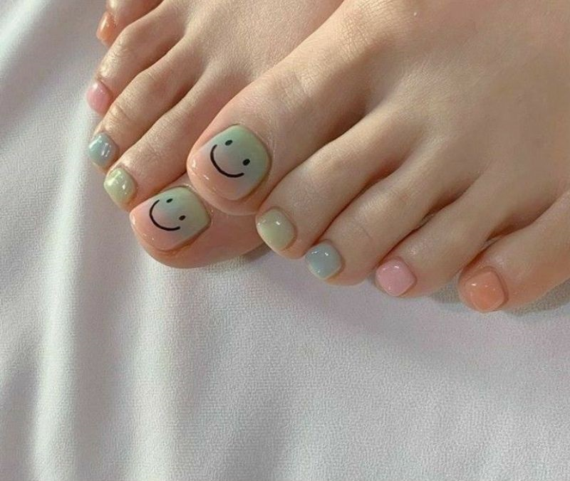 Immerse yourself in a world of joy and creativity with smiley nail designs - the perfect symbol of happiness right at your fingertips!