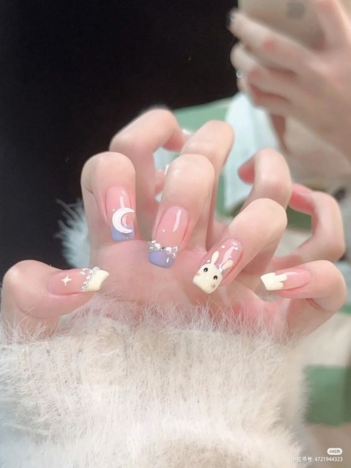 Pink nail design studded with stones and extremely lovely patterns