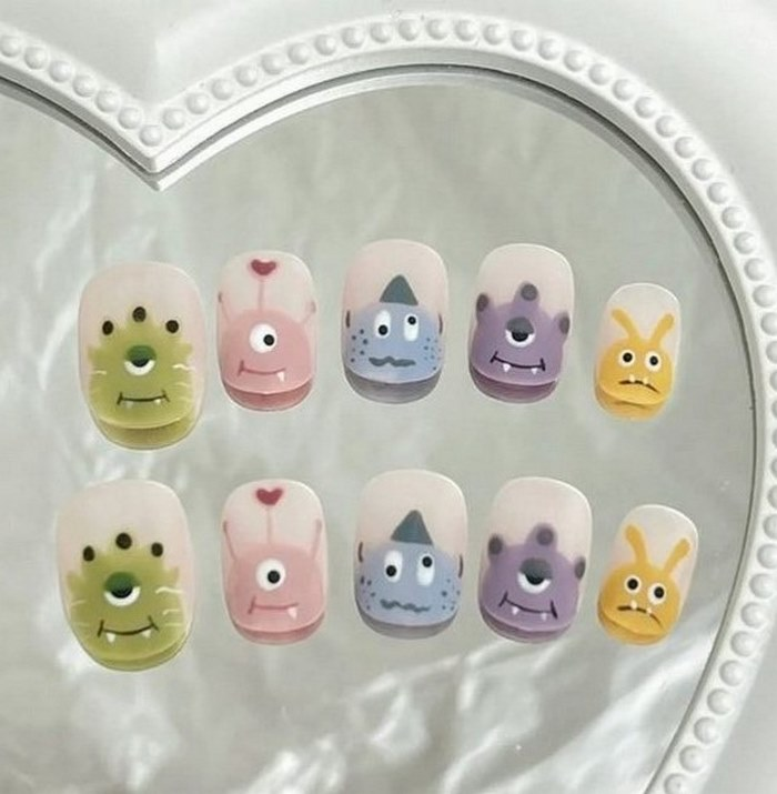 The movie Monster is embellished on the nail design to highlight youthful hands