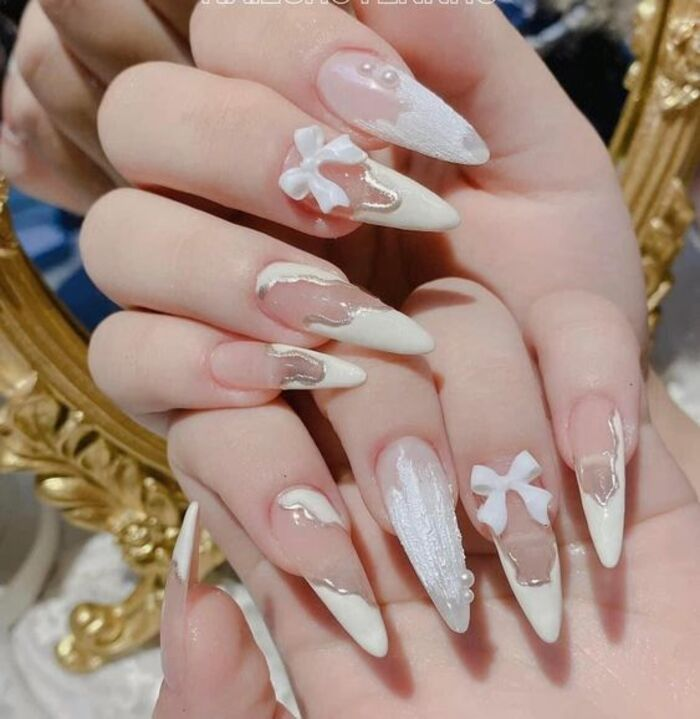 Unique long pointed white nail design