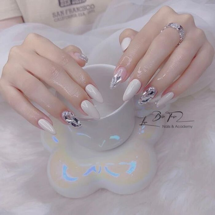 White wedding nail design with beautiful stones