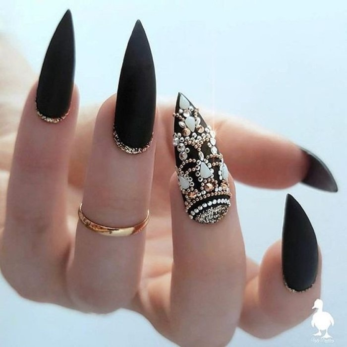 Beautiful black hand nails with luxurious stones