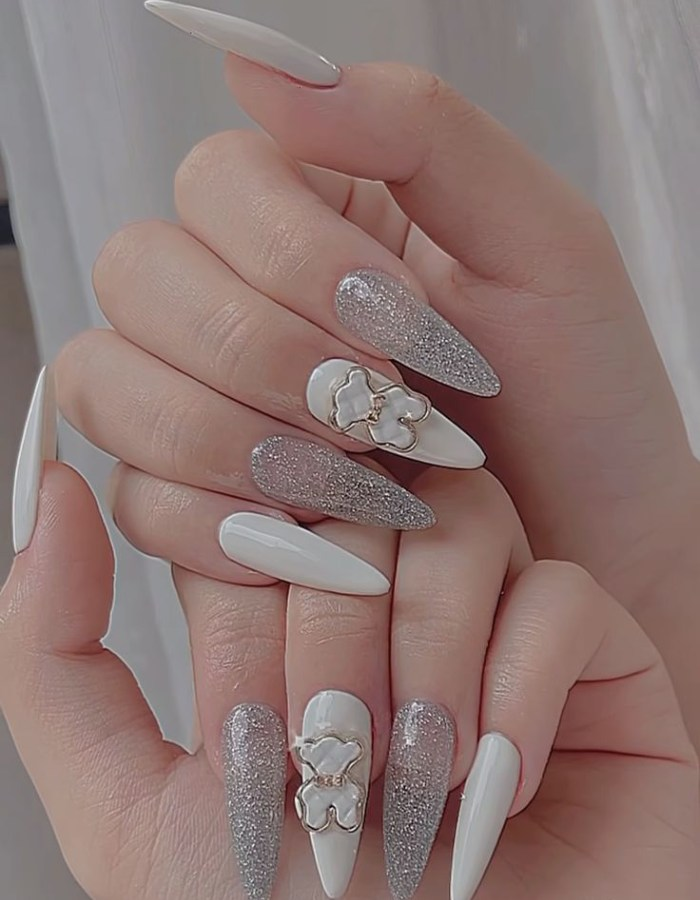 Painted rhinestones on long nails with unique stone bears