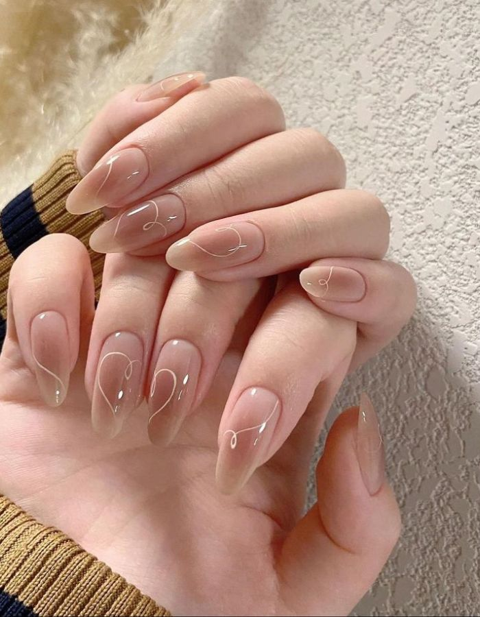 Jelly painted nail design decorated with a gentle heart