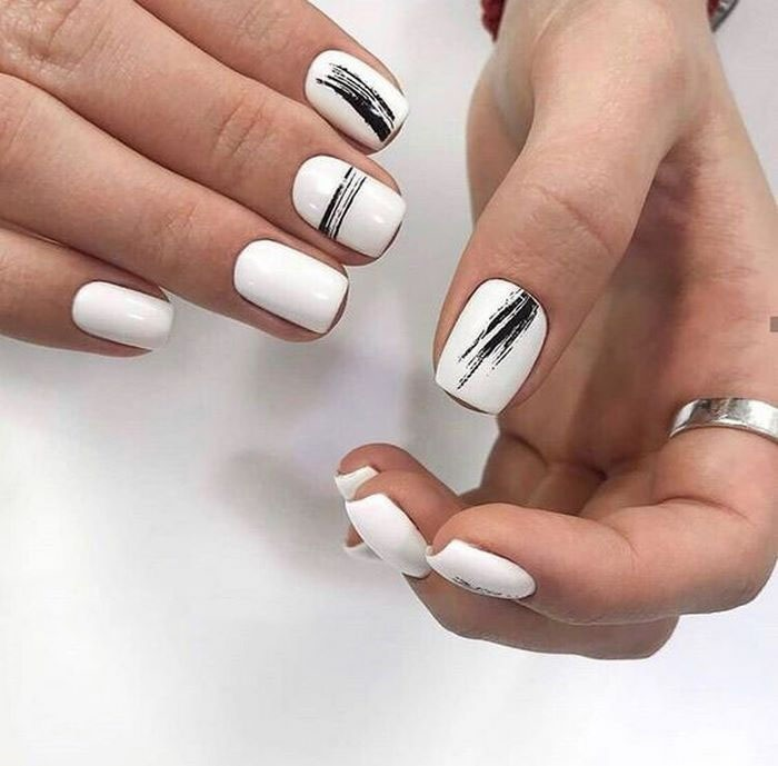 Beautiful black patterned nails on a white background for her