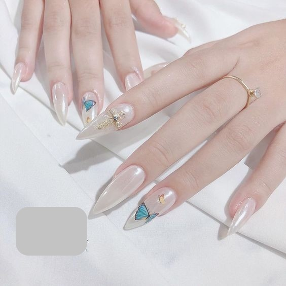 Simple white pointed round nail design