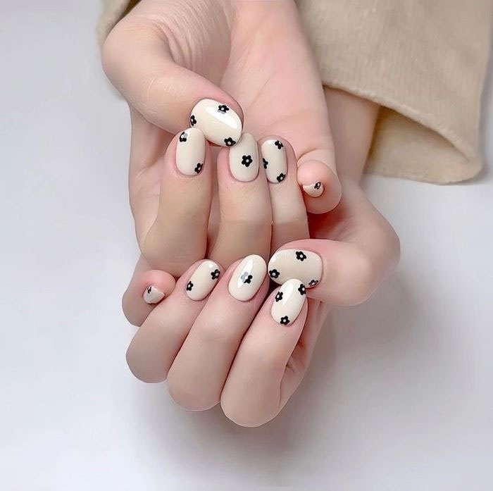 Nails painted with cute little flowers