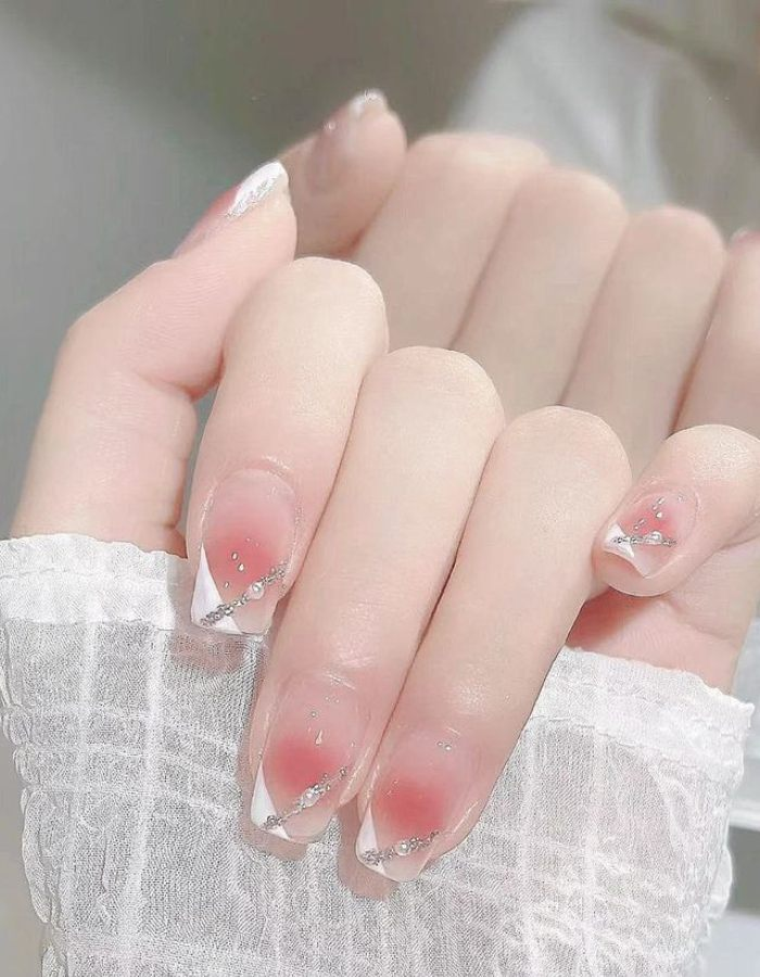 Jelly painted nail design with transparent stones with unique accents