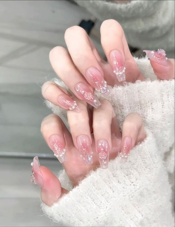 Pink rhinestone nails with delicate stones for her