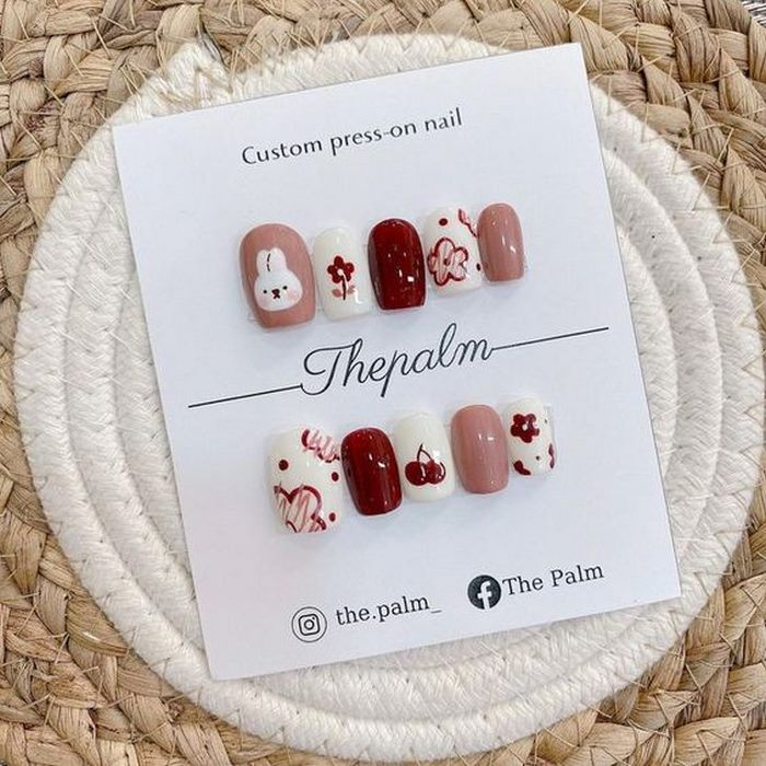 Cuteness and fun on each finger with cartoon nails.