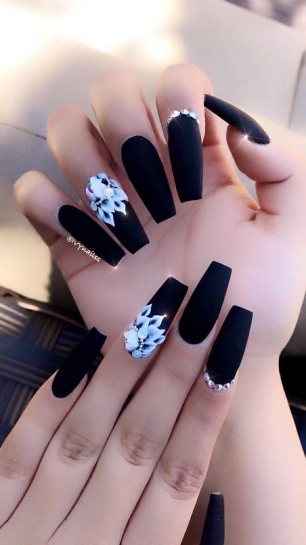 Chic black nail designs with floral accents, black accents, elegant styling — design 24