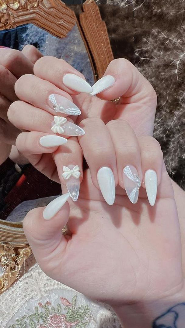 Use beautiful white charms that match your nail tone