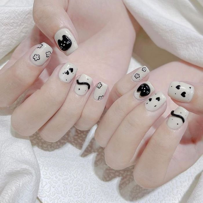 Simple short black and white nail polish