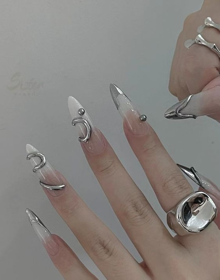 Luxurious white and silver pointed round nail design