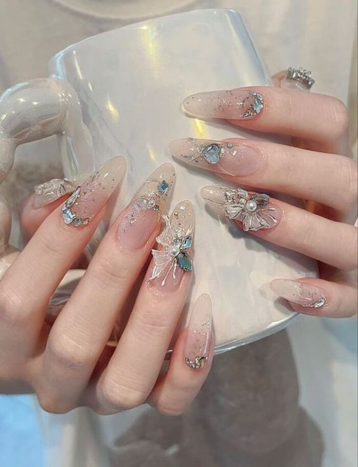 Long nail design with beautiful stones