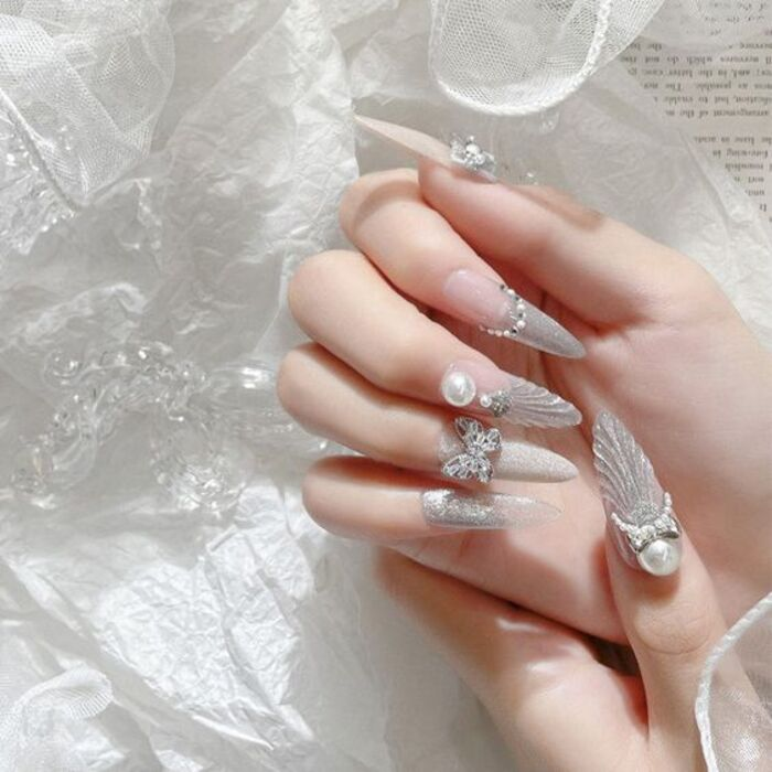 Sparkly wedding nails with long pointed form