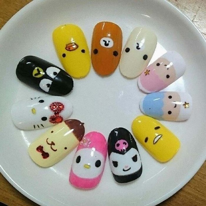 Cartoon nail designs create a cute feeling