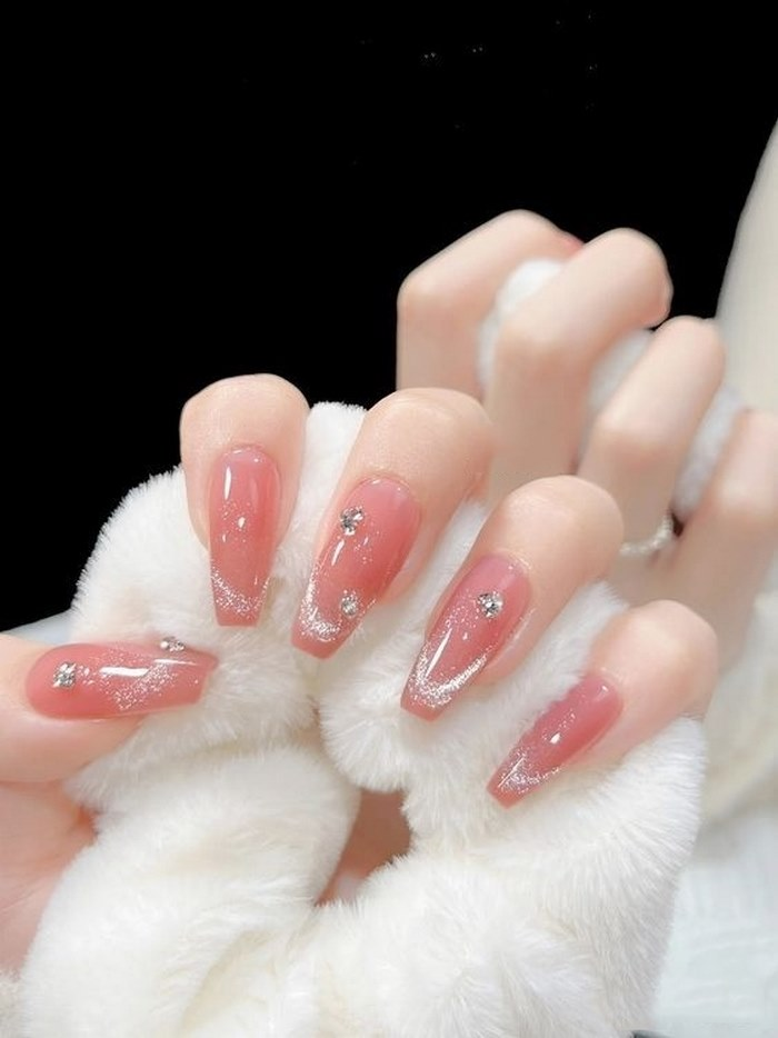 Soft pink jelly nail designs with rhinestones, pink accents, bold styling — design 92