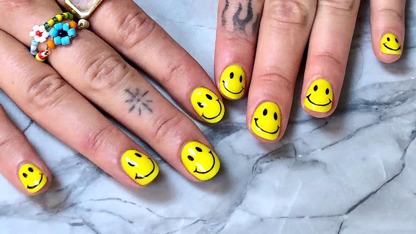 Put a personal touch on each finger with smiley nails, a nail style that brightens up your every moment