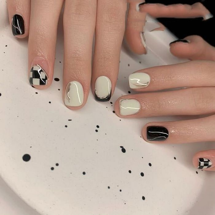 Paint nails with main color tones of black and white