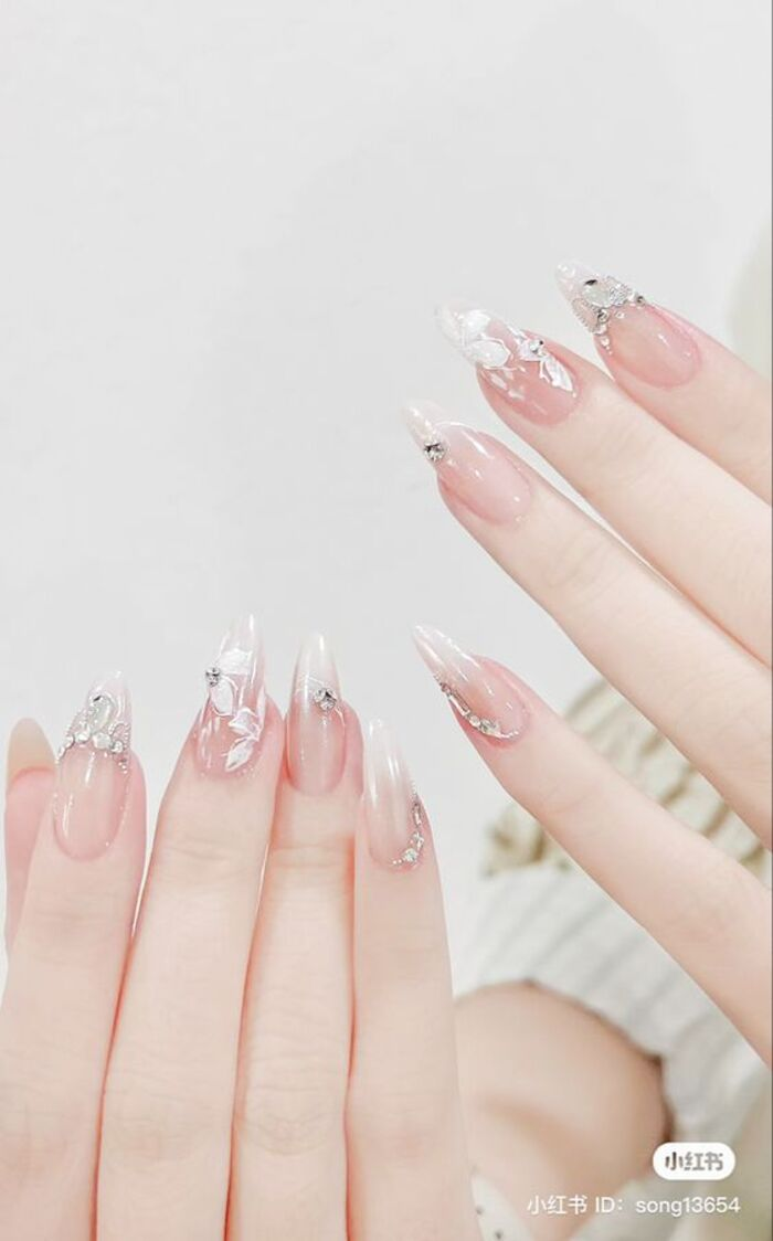 Simple wedding nail design with white motifs