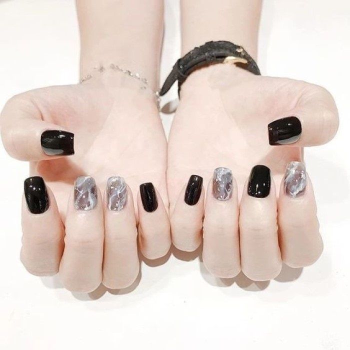 Chic black nail designs with black accents, elegant styling — design 7