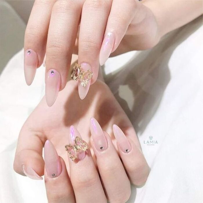 Pale pink strawberry nails with beautiful motifs