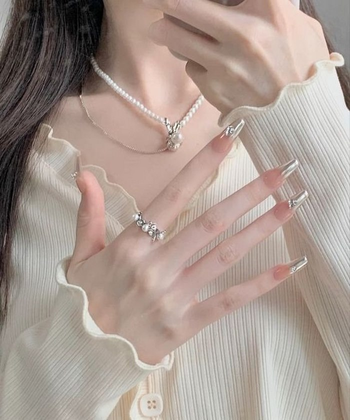 Instantly transform into a muse with pink rhinestone nails