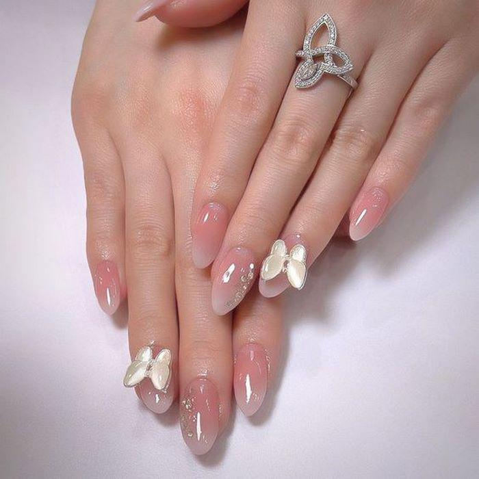 Soft pink jelly nail designs with butterfly accents — design 33