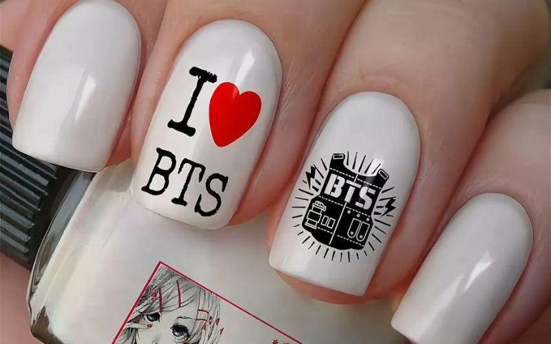 Bts-inspired nail designs for army with bow charms, bold styling — design 6