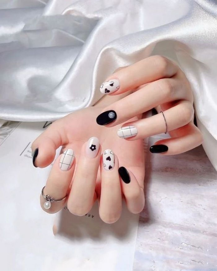 Neutral colored nails with round nail shape help slim hands