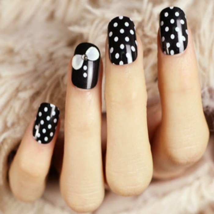 Short black nails with white polka dots