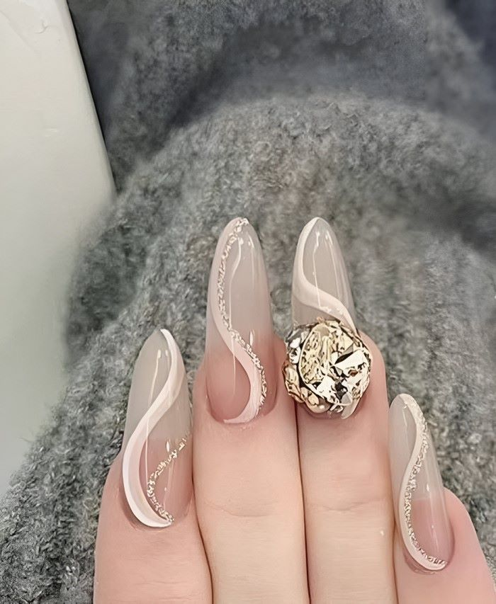 Round pointed nail design with beautiful stones