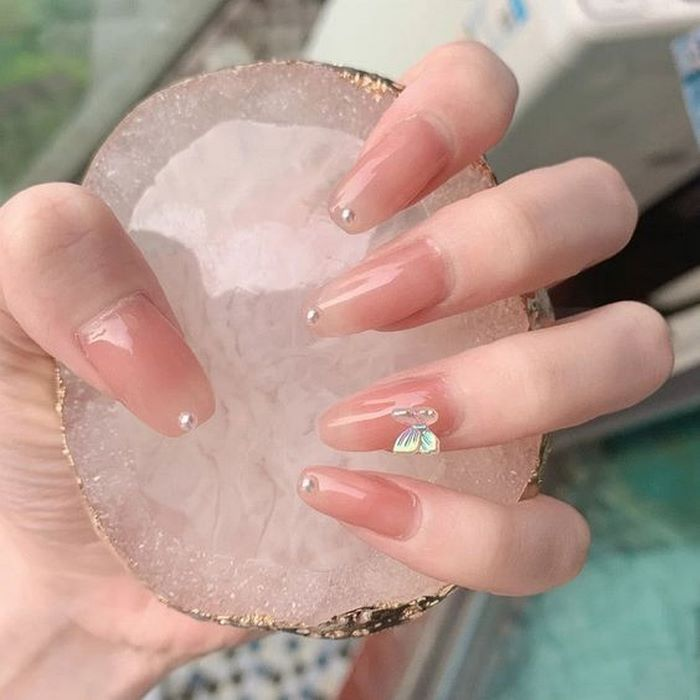 Soft pink jelly nail designs with butterfly accents, bow charms — design 28