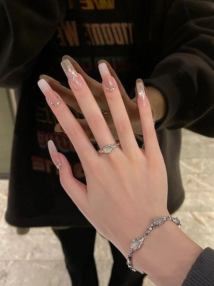 Pink nails with rhinestones are super striking for your hands