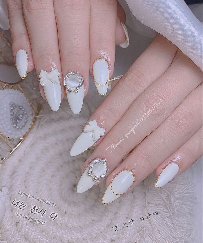 Outstanding white nails, combined with lovely charm