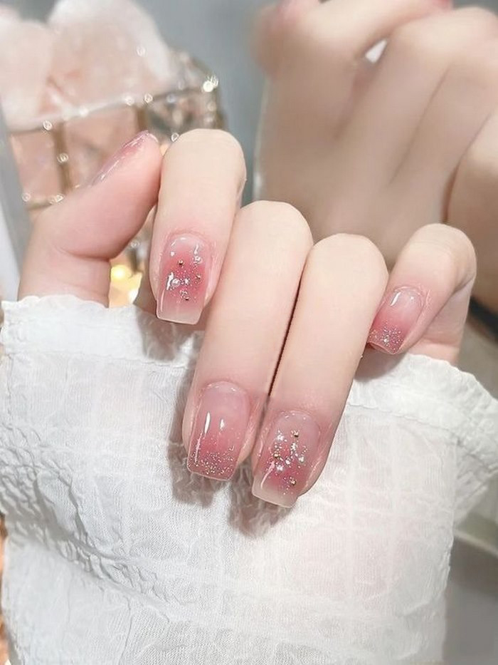 Simple pink rhinestone nails for children