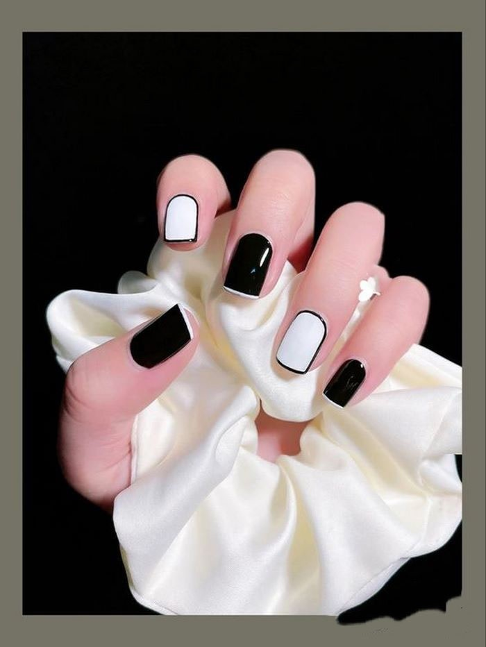 Short black nails, white tips, extremely unique