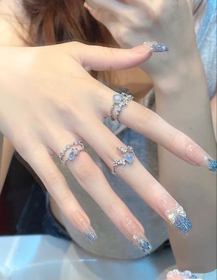 Beautiful, mysterious blue rhinestone nail design