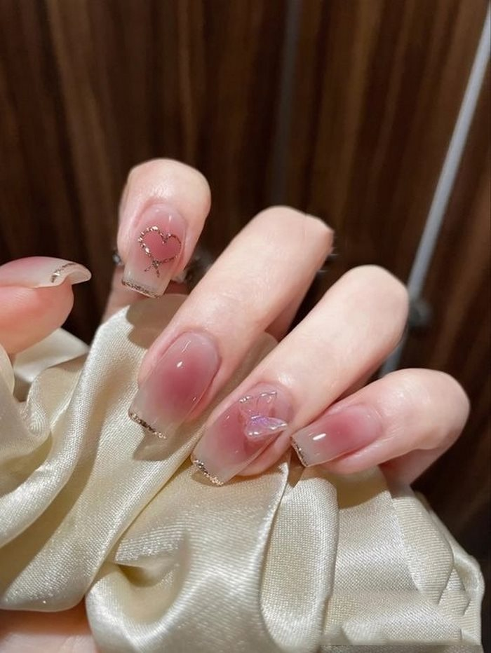 More feminine with pink rhinestone nails